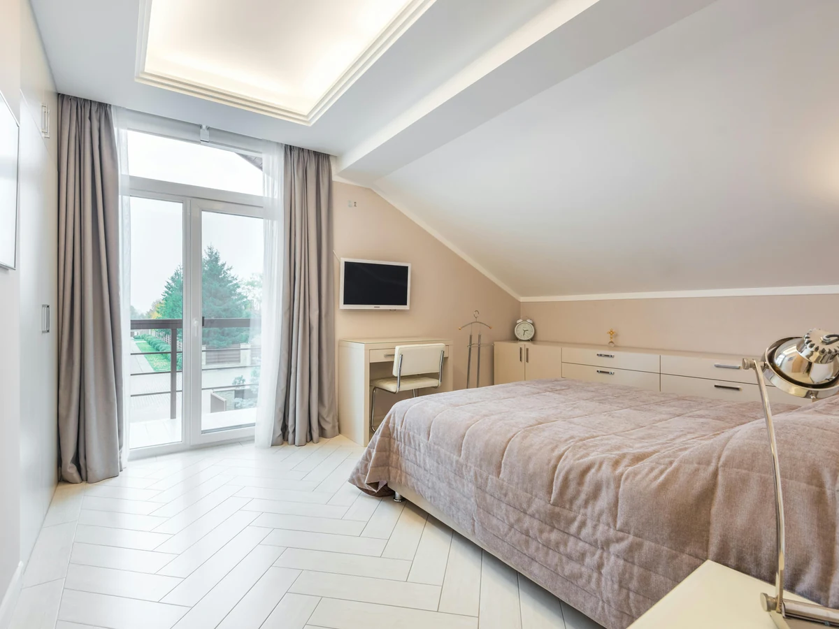 Feature wall colour painting in Harrogate loft bedroom by Harrogate Decorators