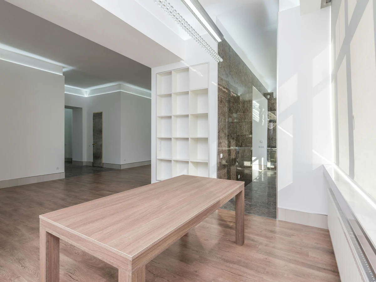 Interior painting of empty room with wooden floor in Harrogate by Harrogate Decorators