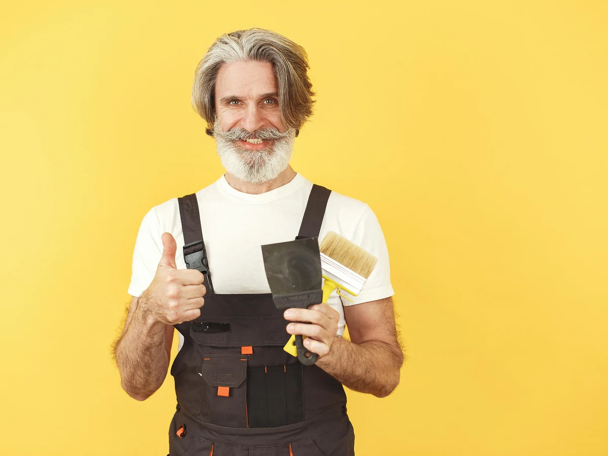 Experienced Harrogate Decorators painter in overalls, plasterboard painting and decorating service