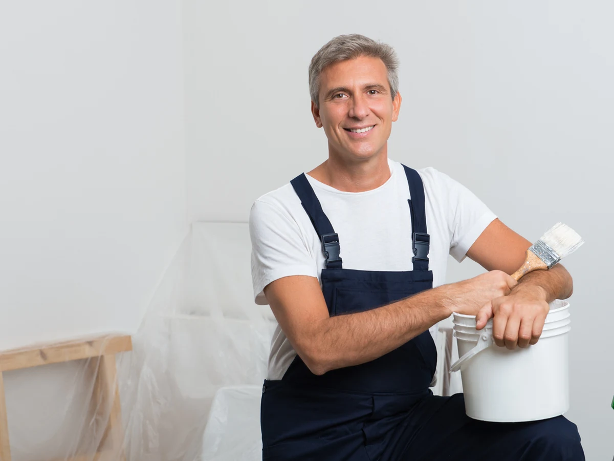 painting-decorating-smiling-painter-bucket-harrogate-decorators Harrogate Decorators wall painter with paint bucket ready for a wall painting job