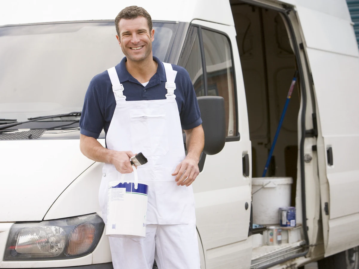 Smiling painter standing ready for home renovation work in Harrogate