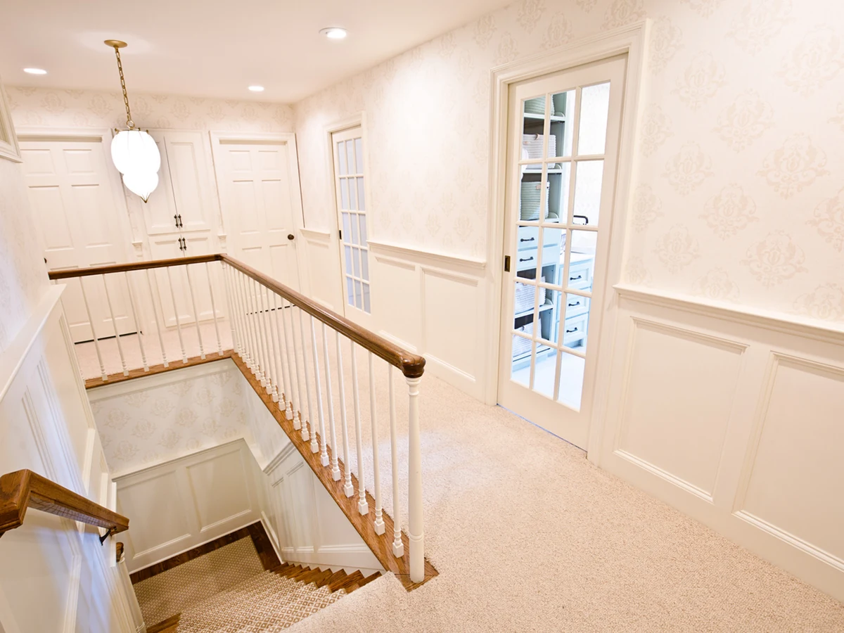 Bright upstairs landing staircase painting by Harrogate Decorators